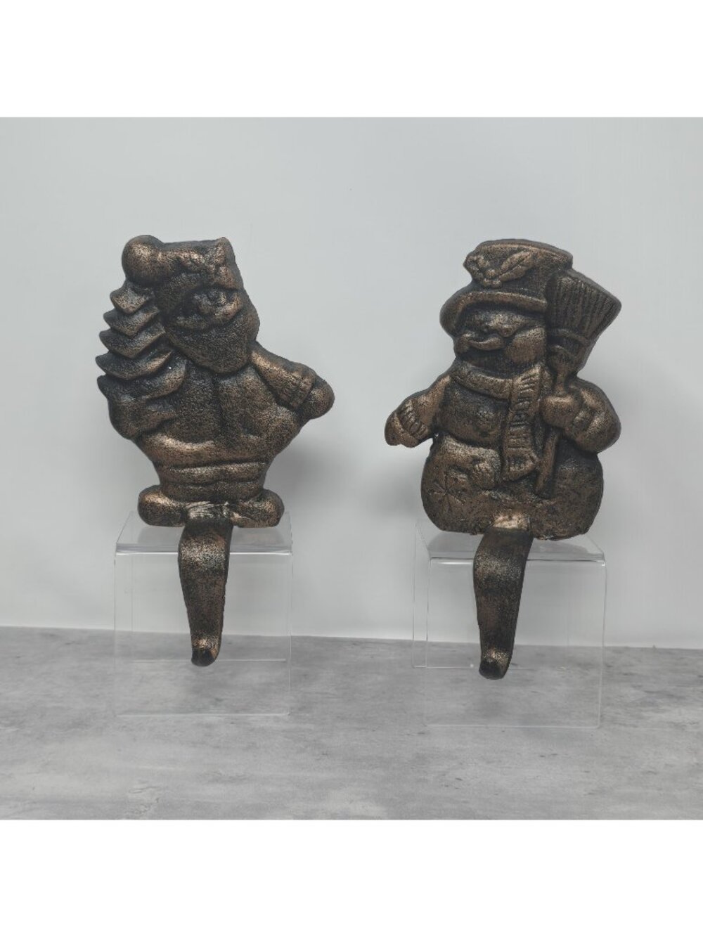 2 Vintage Christmas Shoppe Stocking Holder brown cast iron Santa w/ Tree Snowman